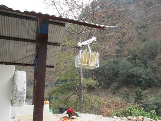A hanging white basket uplifts women in Nepal.