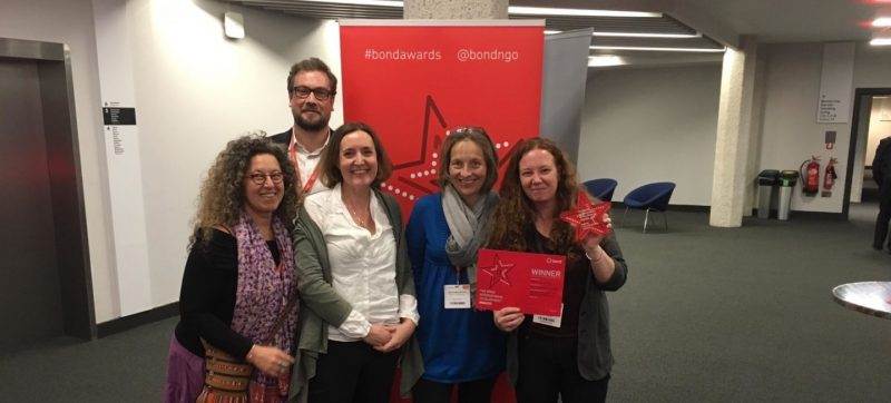 A group of people posing for a picture to celebrate Practical Action's prestigious collaboration award.