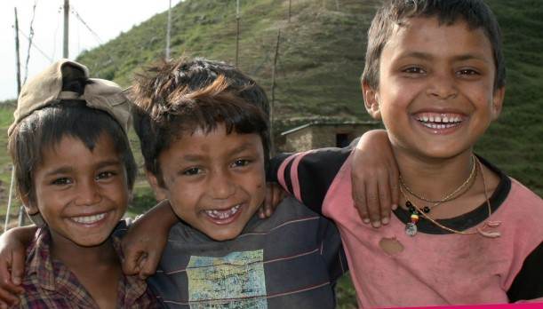 A group of children are smiling in front of a mountain on a STEM careers poster.