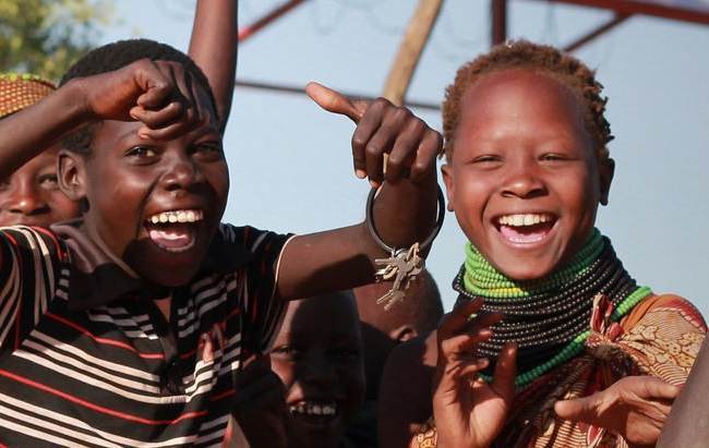 A group of children are posing for a photo.