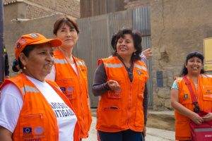 Women in Peru taking part in an evacuation drill in response to floods caused by the climate crisis.