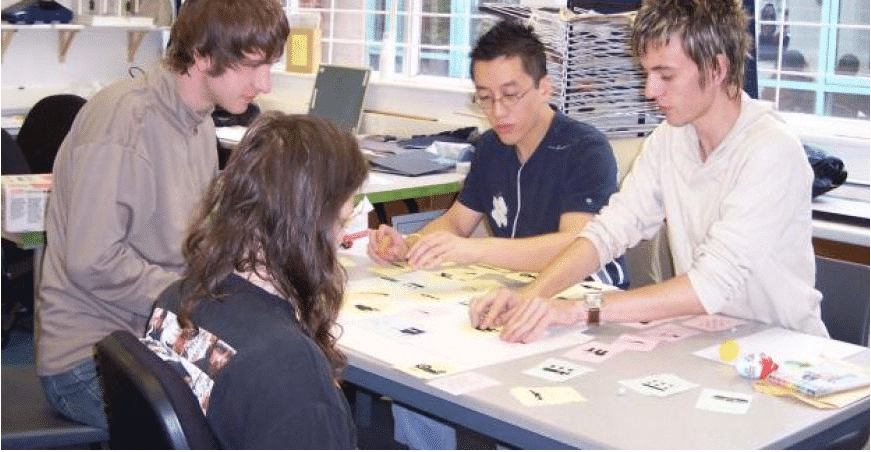 A group of people engaging in a brainstorming session with sticky notes.