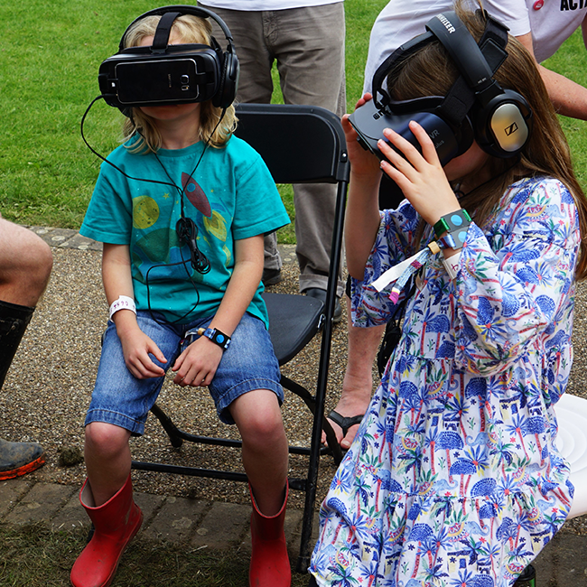 A group of people wearing virtual reality headsets at Bluedot 2019.