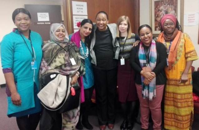 A group of women promoting universal energy access in an office.