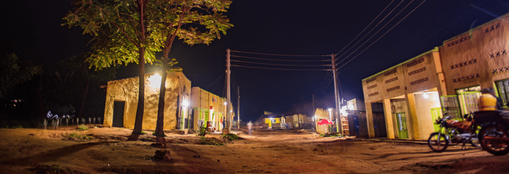 A dirt road at night.