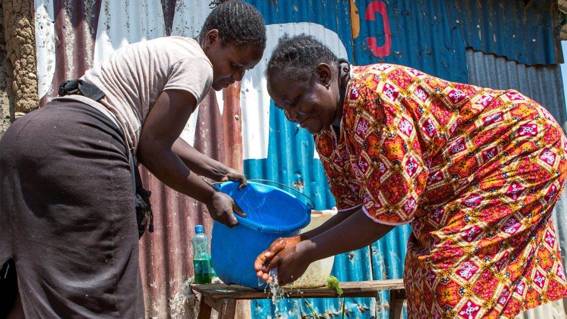 Women washing their hands in rural Africa