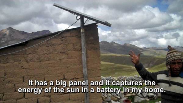 A man captures solar energy using a big panel and stores it in a home battery, showcased in renewable energy videos.