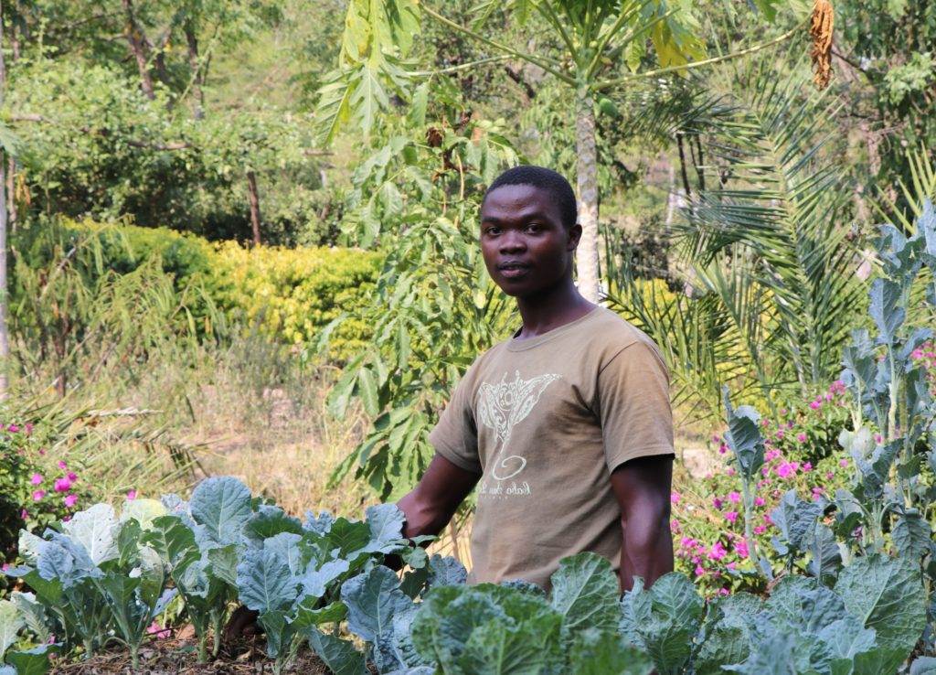 Young farmers cultivating a thriving vegetable garden.