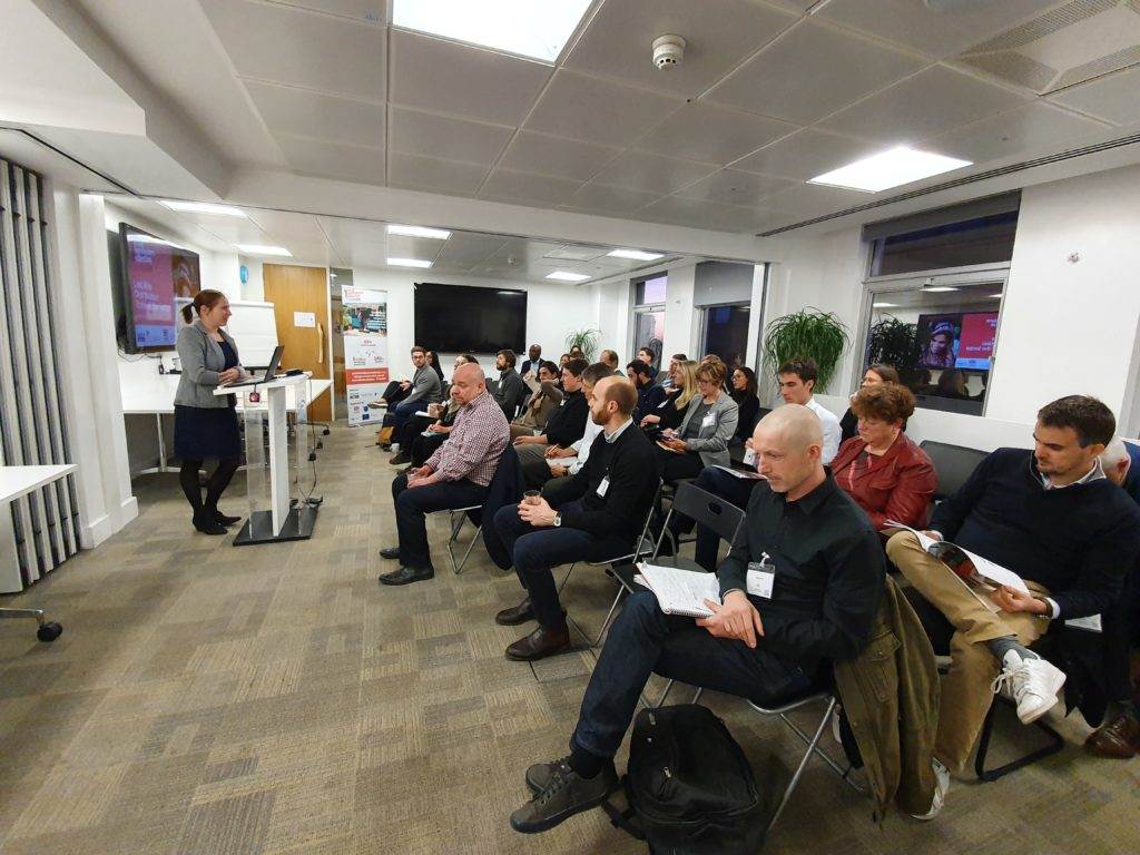 A group of people consulting indoors.