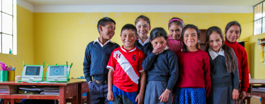 Children smiling in a classroom