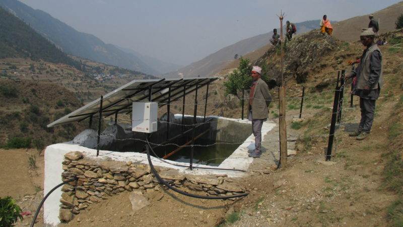 Men working on solar powered irrigation