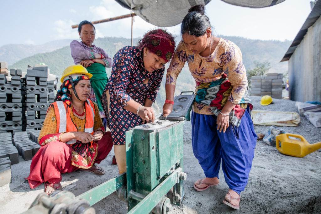 A group of women working on a construction site.