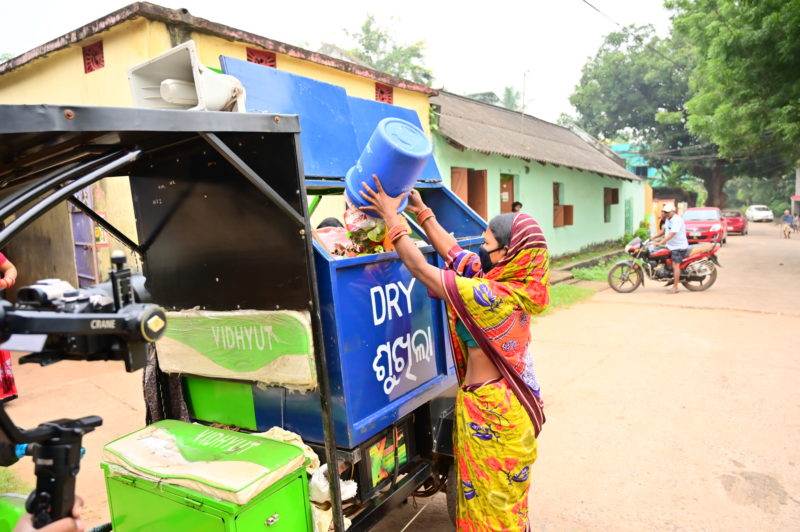 A woman separates waste in Bangladesh