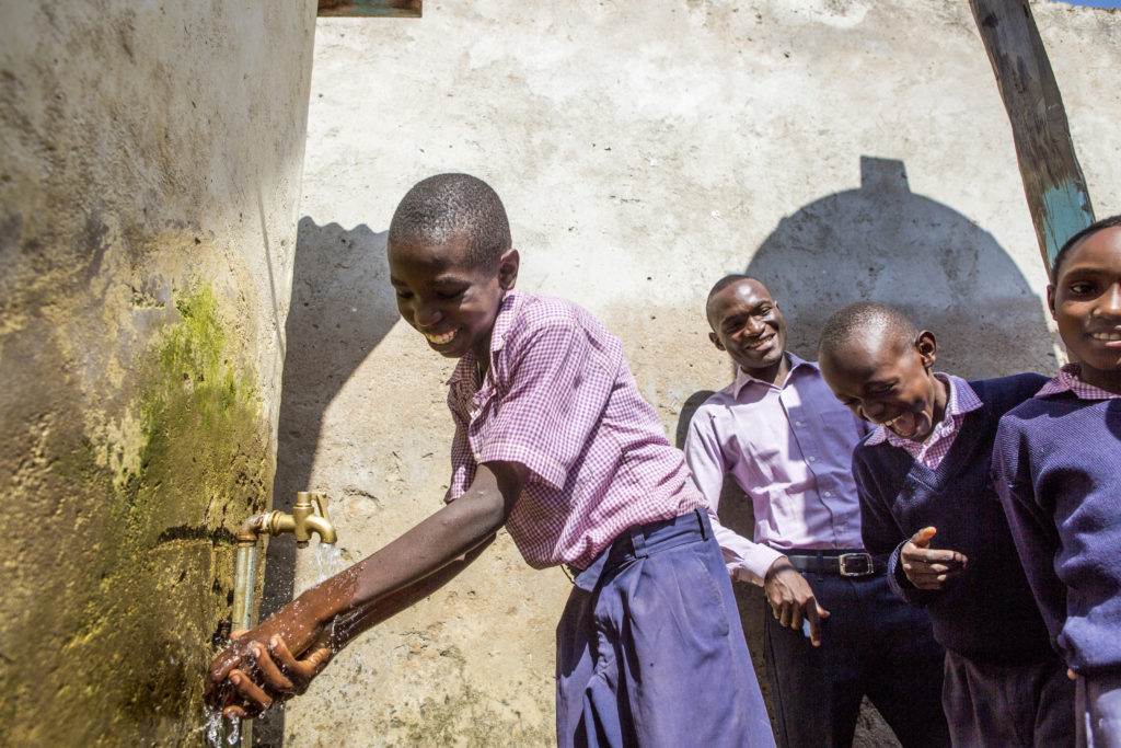 A group of children embracing a new opportunity to help billions cope with climate change.