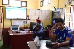Two workers in the District Emergency Operation Centre in Bardiya, Nepal 