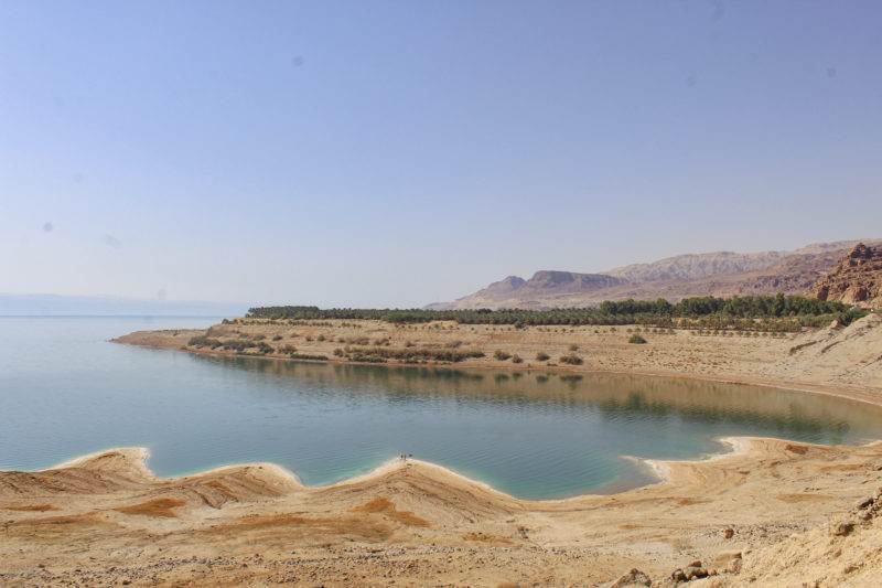 The dead sea is a large body of water in the middle of a desert, highlighting the importance of climate justice for flood-affected people.