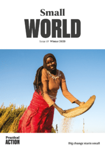 The cover of small world magazine with a woman holding a basket.