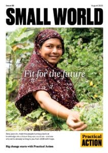 Smiling woman in patterned headscarf tends to green plants outdoors, cover of “SMALL WORLD” magazine.
