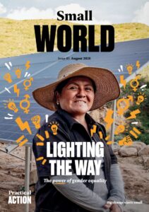 A woman in a hat stands in front of solar panels, smiling, with the magazine headline 