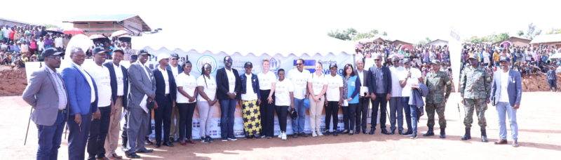 Practical Action launches new phase of Renewable Energy for Refugees project, capturing group in front of a tent.