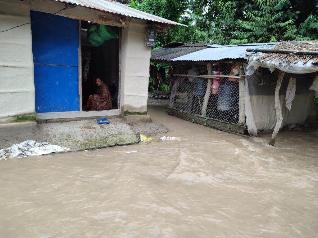 A woman receives first pay-out as flood-hit farmer in Nepal under new climate insurance scheme.
