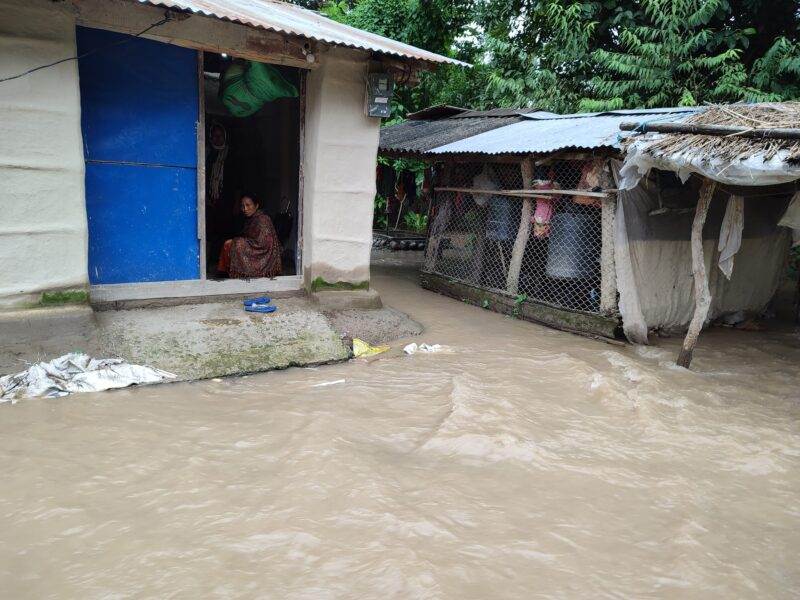 A woman receives first pay-out as flood-hit farmer in Nepal under new climate insurance scheme.