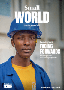 Small World Magazine's Issue 80 featuring a man in a hard hat on the cover.