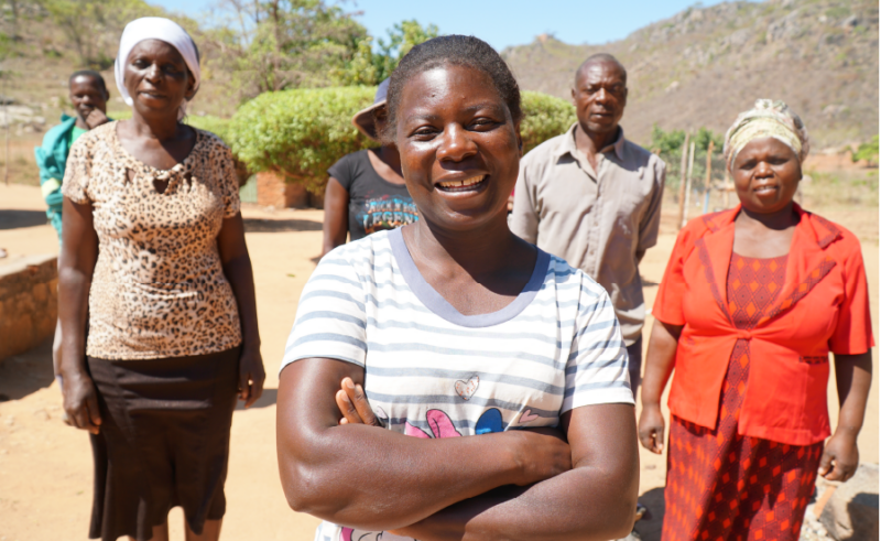 A woman from Practical Action is standing in front of a group of people at Africa Climate Week 2023.