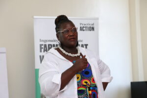 Easter Okech - A determined woman empowering a group of people through her presentation.