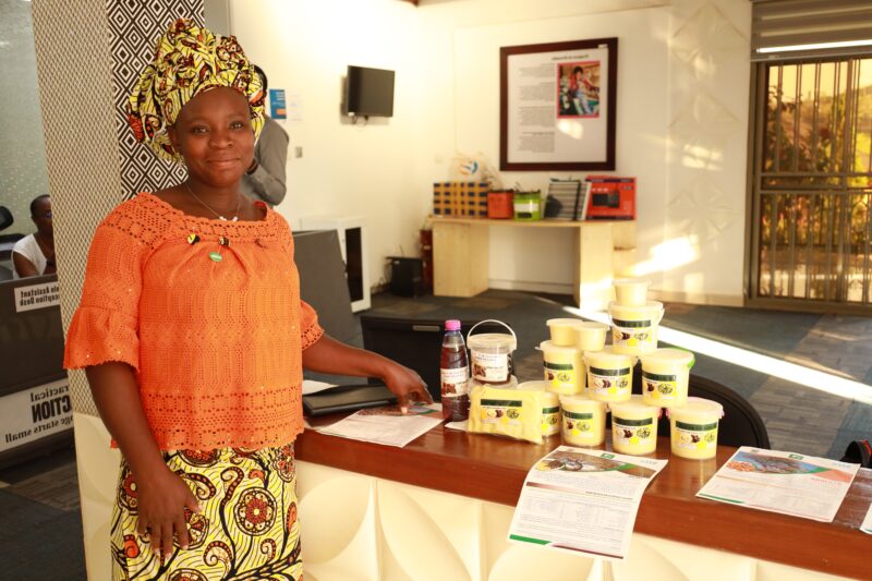 A woman standing in front of a counter, taking practical action.