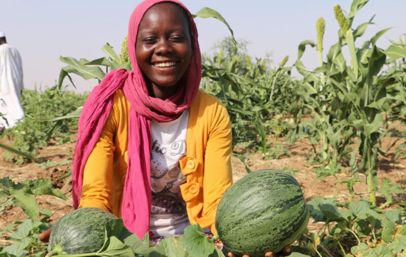 A woman holding a watermelon in North Darfur.