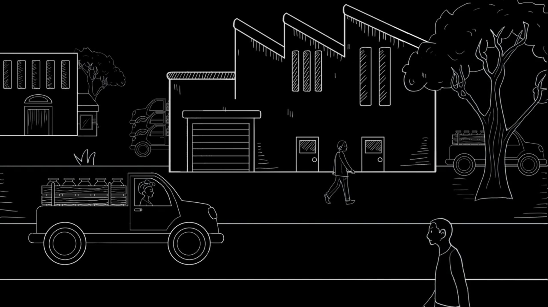 A person walks past a factory building, while another person drives a truck loaded with water jugs; a person stands by a tree in the foreground.